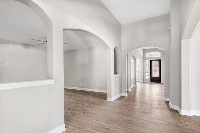 interior space with ceiling fan and hardwood / wood-style flooring