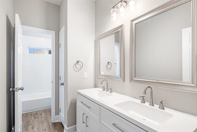 bathroom with hardwood / wood-style floors and vanity