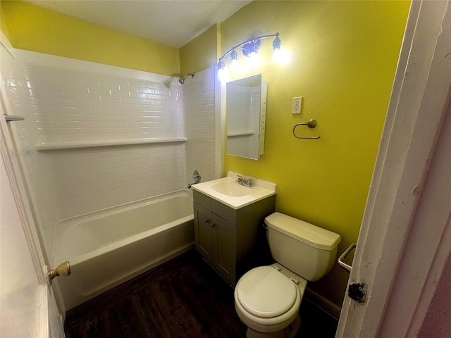 full bathroom featuring hardwood / wood-style flooring, shower / bathing tub combination, toilet, and vanity