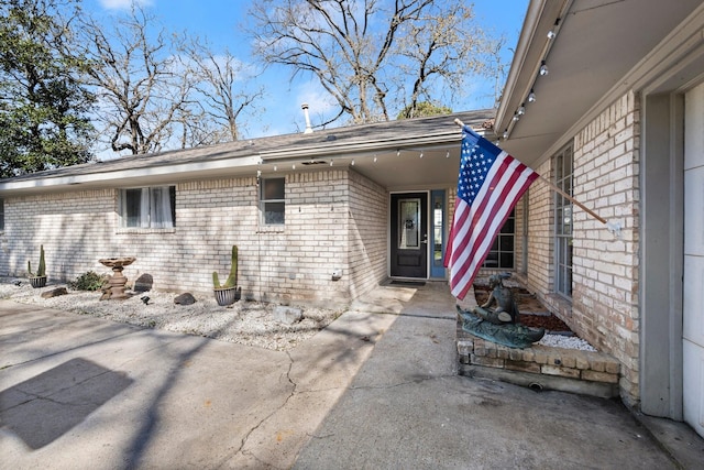 property entrance featuring a patio