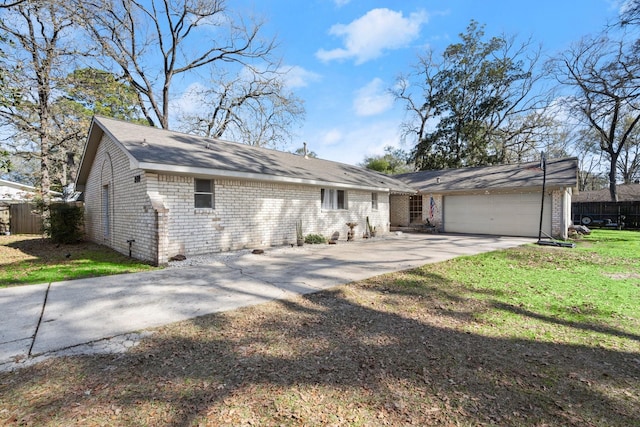 ranch-style home with a garage and a front yard