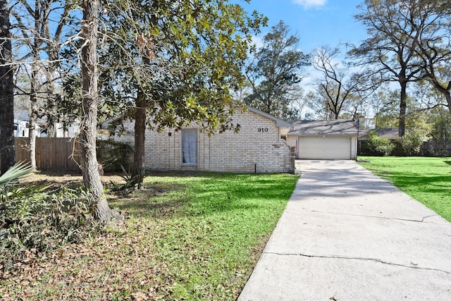 910 Brook Forest Ct, Conroe, TX 77385 - view of front of property with brick siding, concrete driveway, and a garage