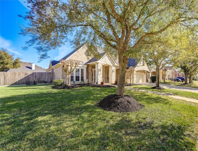 view of front facade with a front lawn and a garage