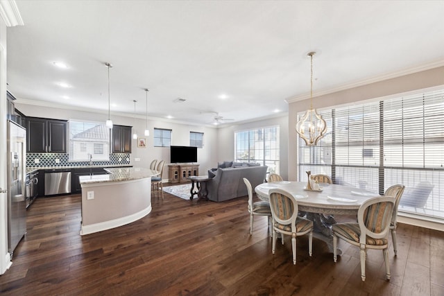 dining room featuring crown molding, dark hardwood / wood-style floors, and ceiling fan with notable chandelier