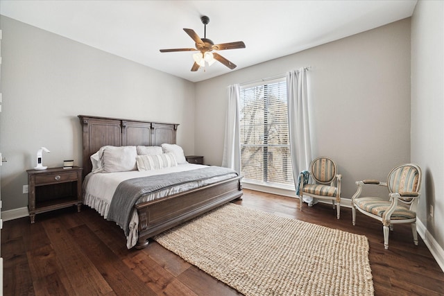 bedroom with dark hardwood / wood-style flooring and ceiling fan