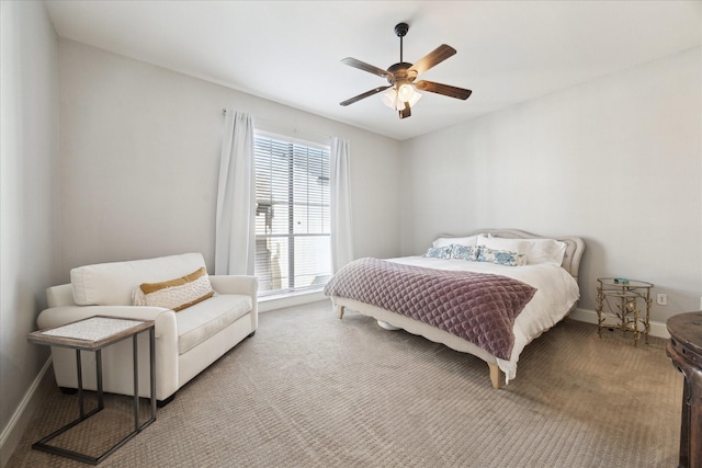 bedroom featuring ceiling fan and carpet