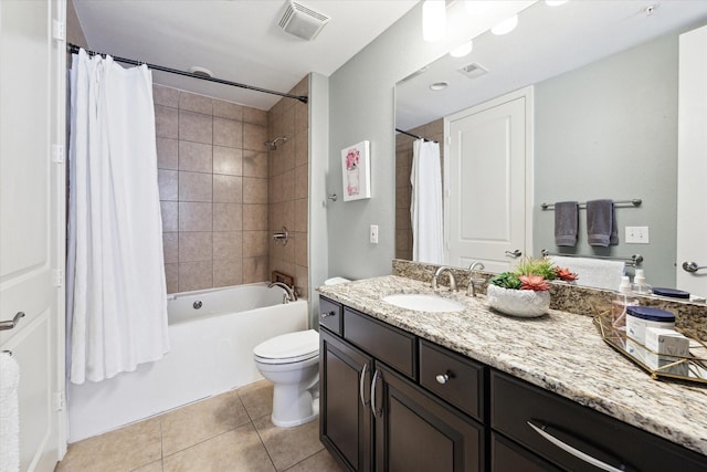 full bathroom featuring vanity, shower / tub combo with curtain, tile patterned floors, and toilet