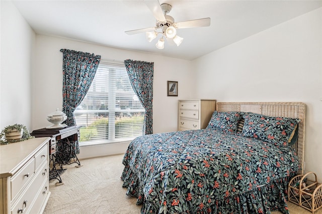 bedroom featuring ceiling fan and light colored carpet