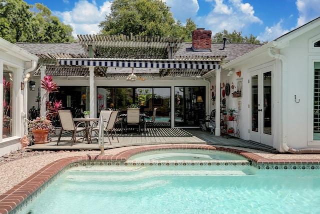 view of swimming pool with french doors, a pergola, an in ground hot tub, and a patio