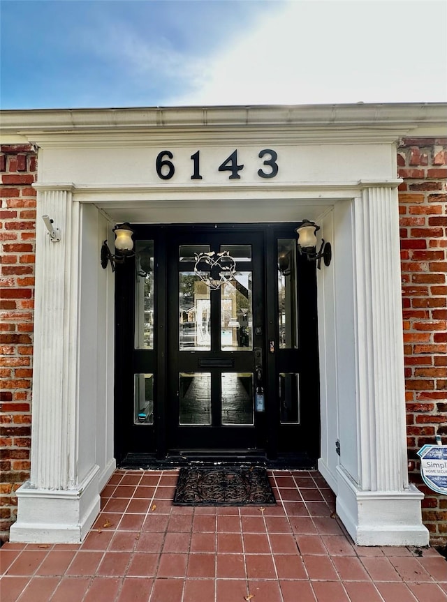 6143 Ella Lee Ln, Houston, TX 77057 - view of exterior entry with french doors and brick siding