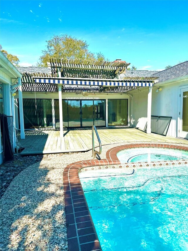 view of pool featuring a deck and a pergola