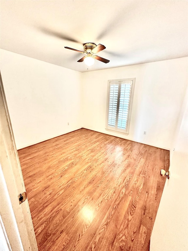 unfurnished room with ceiling fan and light hardwood / wood-style floors