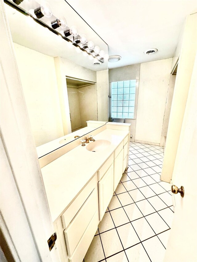 bathroom with vanity and tile patterned floors