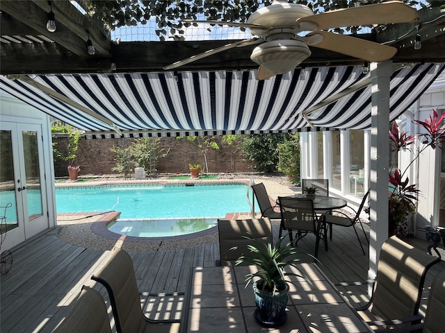6143 Ella Lee Ln, Houston, TX 77057 - view of swimming pool featuring french doors, a fenced in pool, outdoor dining space, and a deck