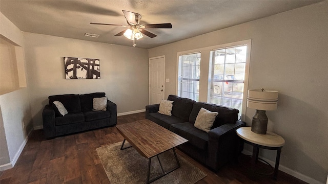 living room with ceiling fan and dark hardwood / wood-style floors