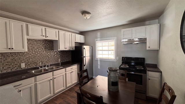 kitchen featuring dark wood-type flooring, appliances with stainless steel finishes, sink, and white cabinetry