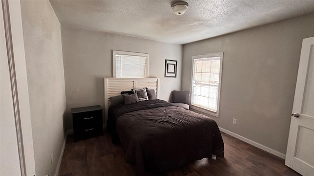 bedroom featuring dark wood-type flooring