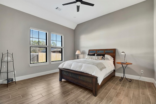 bedroom featuring ceiling fan and vaulted ceiling