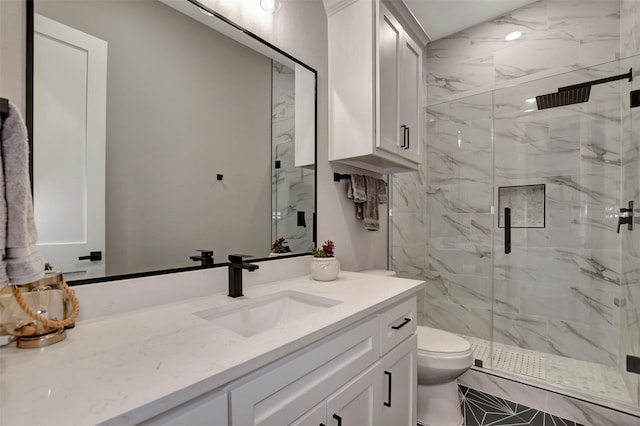 bathroom featuring toilet, walk in shower, and vanity