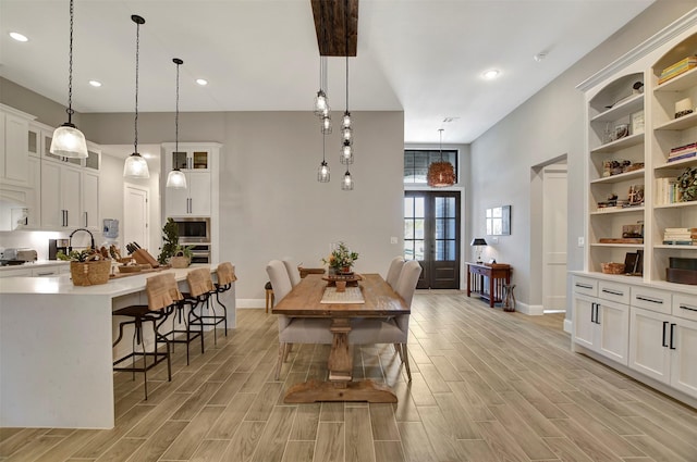 dining room featuring sink and french doors