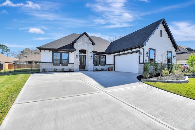 view of front of property with a front lawn and a garage