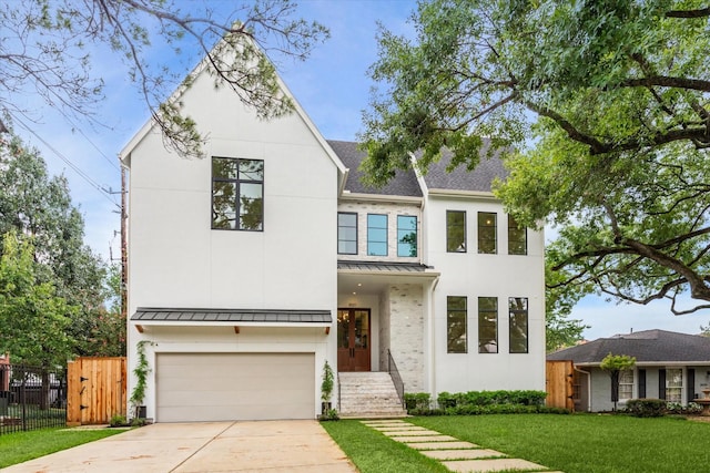 view of front facade featuring a front lawn and a garage