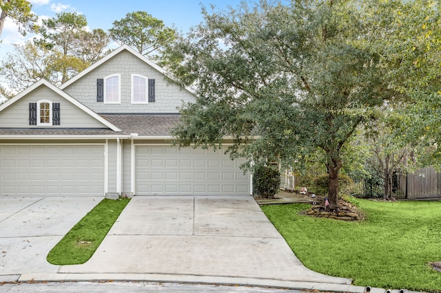 view of front of property featuring a garage and a front yard