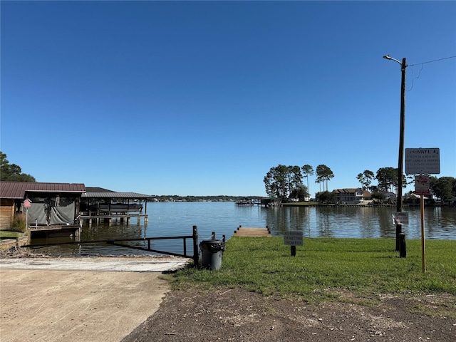 dock area with a water view