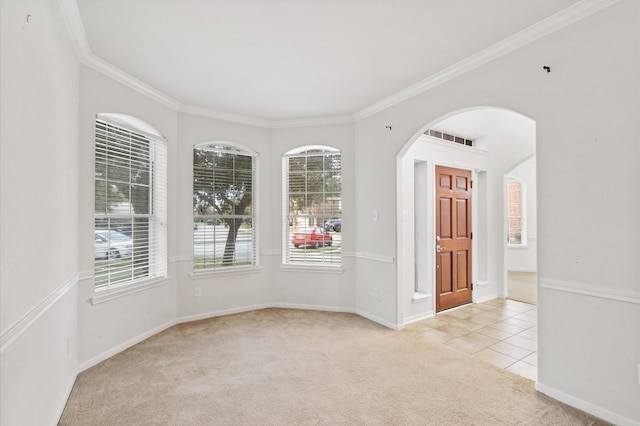 carpeted empty room featuring ornamental molding