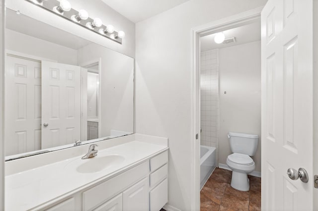 full bathroom with toilet, vanity, and shower / washtub combination