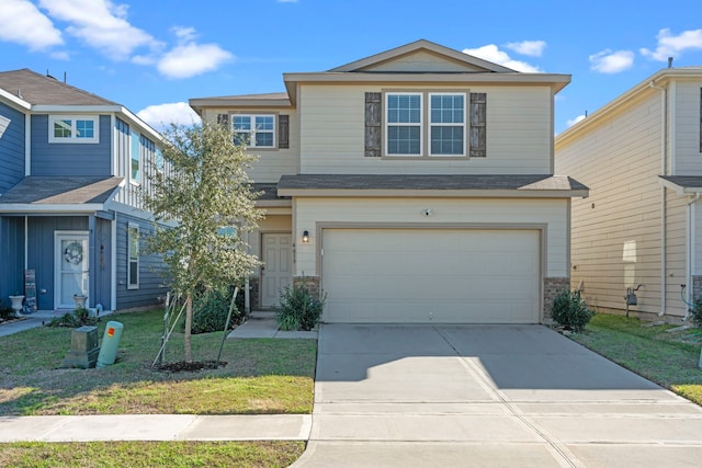 front of property with a front lawn and a garage