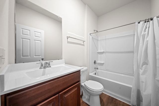 full bathroom with toilet, hardwood / wood-style floors, vanity, and shower / bathtub combination with curtain