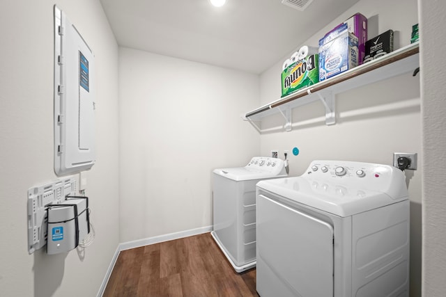 washroom featuring washer and dryer and dark hardwood / wood-style floors