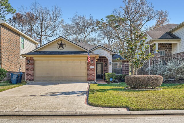 view of front of home featuring a front yard and a garage