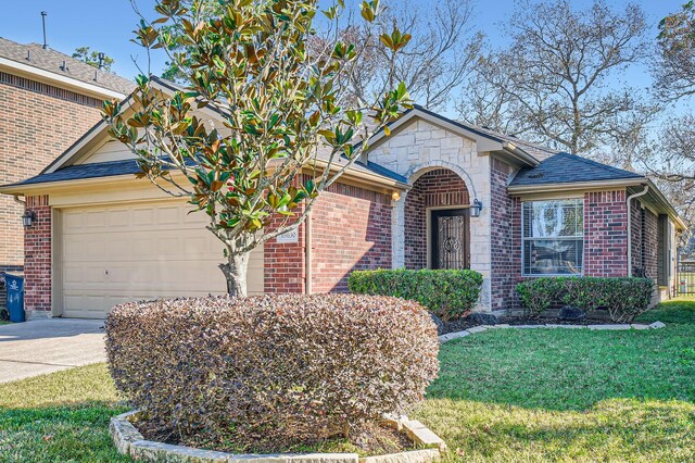 view of front of house with a garage and a front yard