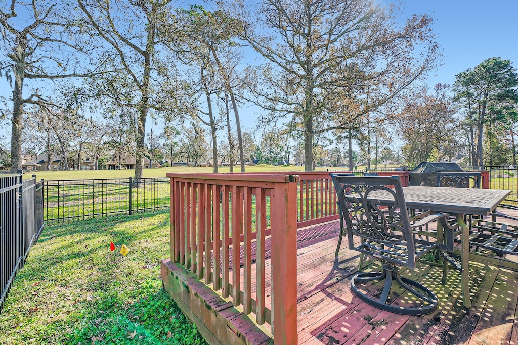 deck featuring a lawn