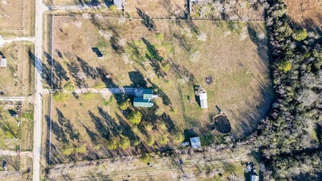 birds eye view of property with a rural view