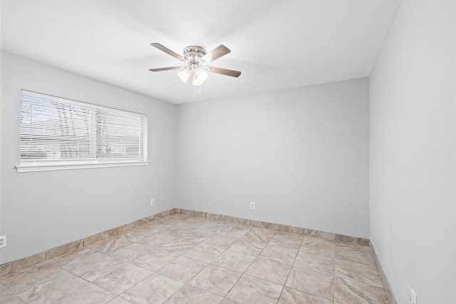 spare room featuring ceiling fan