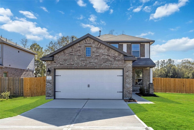 view of front of house with a front yard and a garage