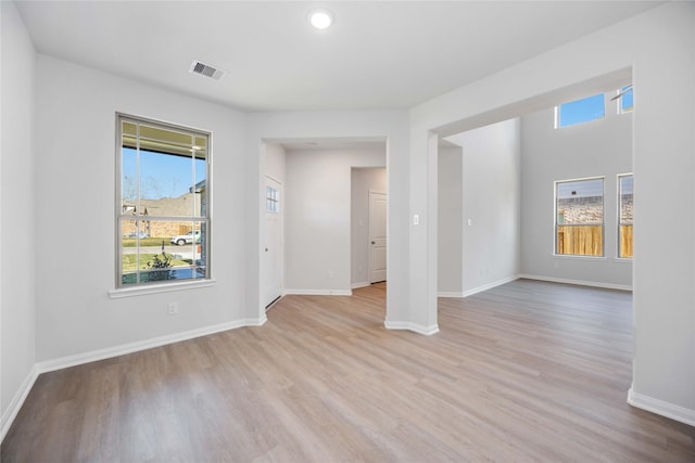 spare room featuring light wood-type flooring