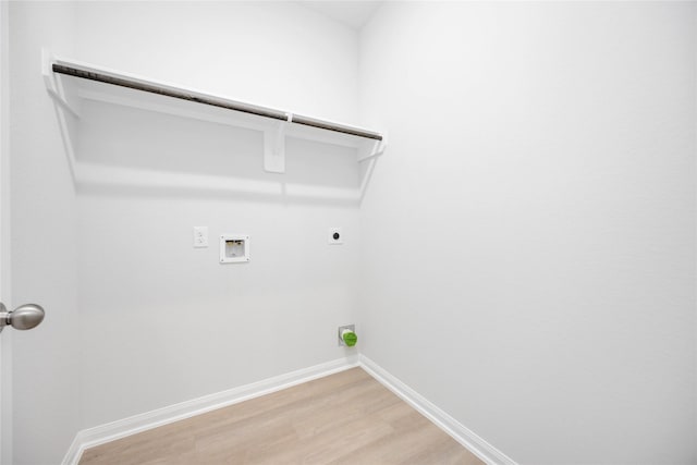 clothes washing area with hookup for a washing machine, wood-type flooring, and hookup for an electric dryer