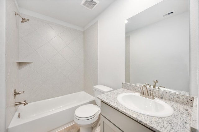 full bathroom with toilet, tiled shower / bath, and vanity