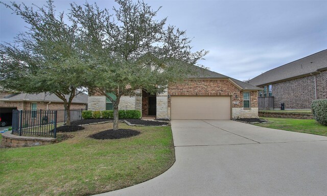 view of front of house featuring a front yard and a garage