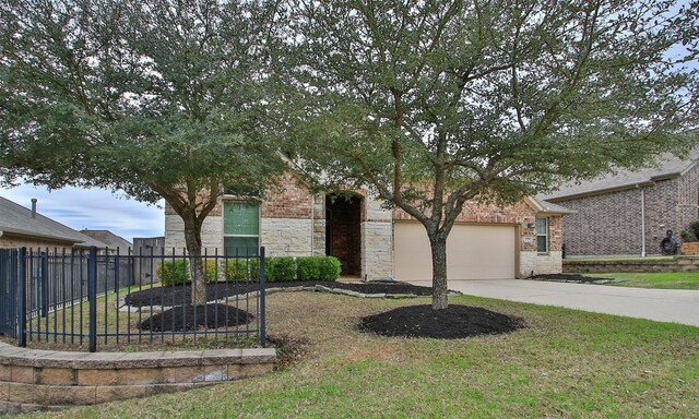 view of front of property featuring a front yard and a garage