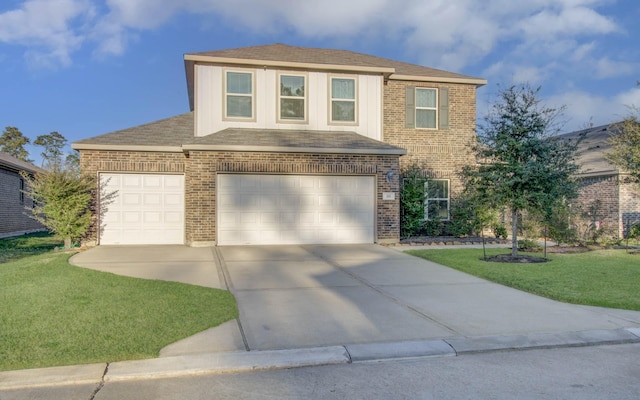 view of front of house with a garage and a front lawn