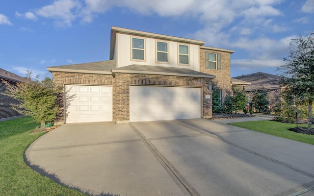 view of front of property with a front lawn and a garage