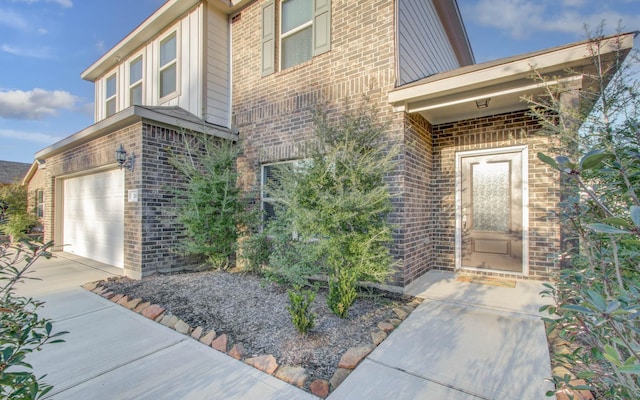 doorway to property featuring a garage