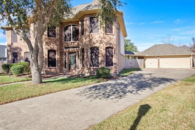 view of front facade with a garage and a front yard