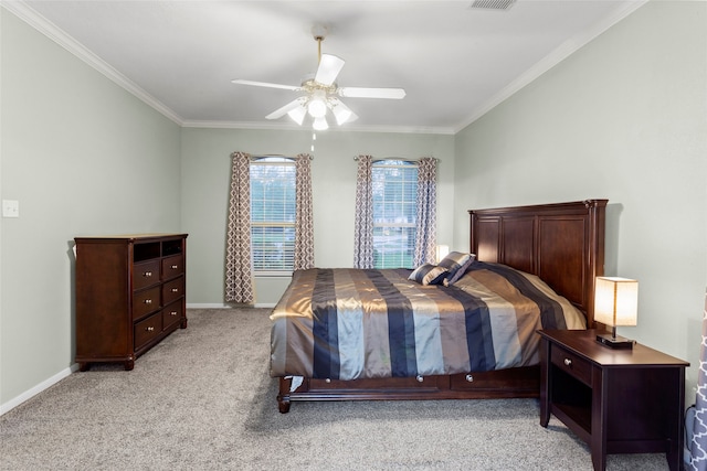 bedroom with ceiling fan, ornamental molding, and light carpet