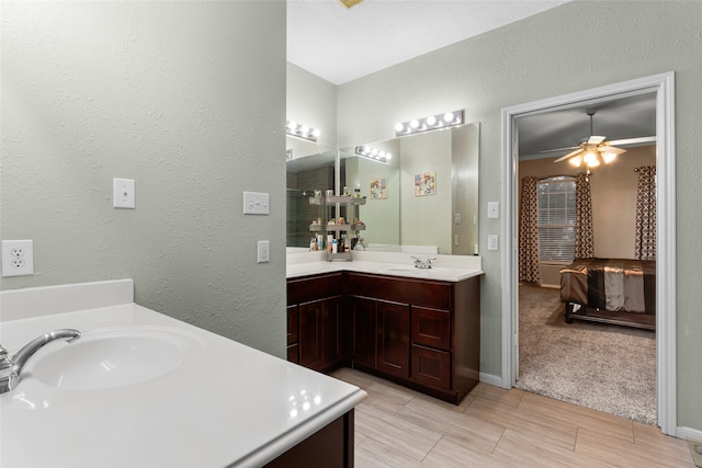 bathroom featuring ceiling fan and vanity